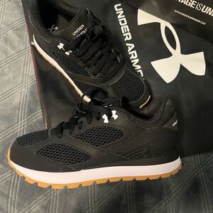 Size 4 youth Under Armour Black and White Athletic Shoes with Cushioned Midsole